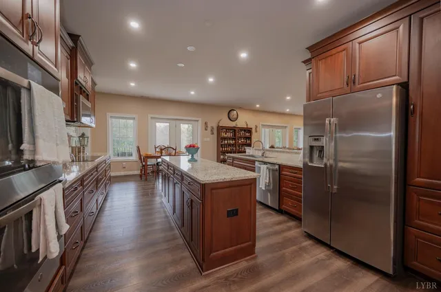 a view of a a dining room with furniture window and wooden floor