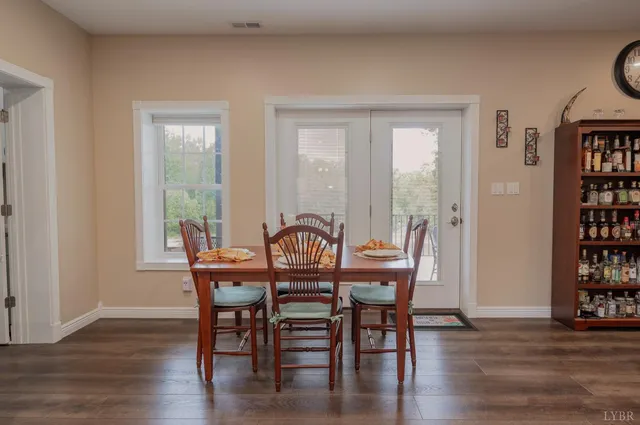 a kitchen with stainless steel appliances granite countertop a stove and a wooden floors