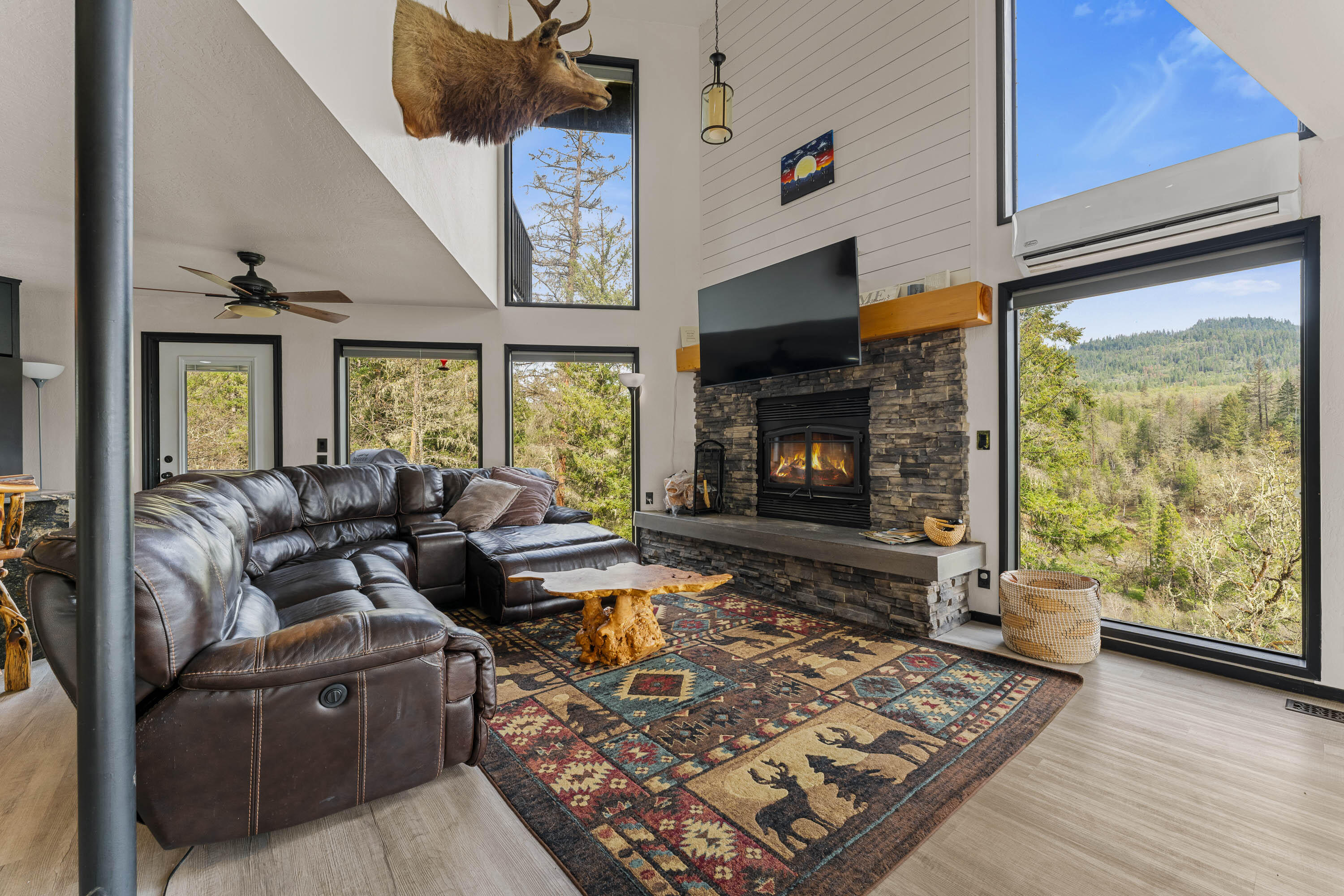 7201 Crowfoot Road Trail, OR 97541 - Photo 10 of 56 a living room with furniture and a fireplace