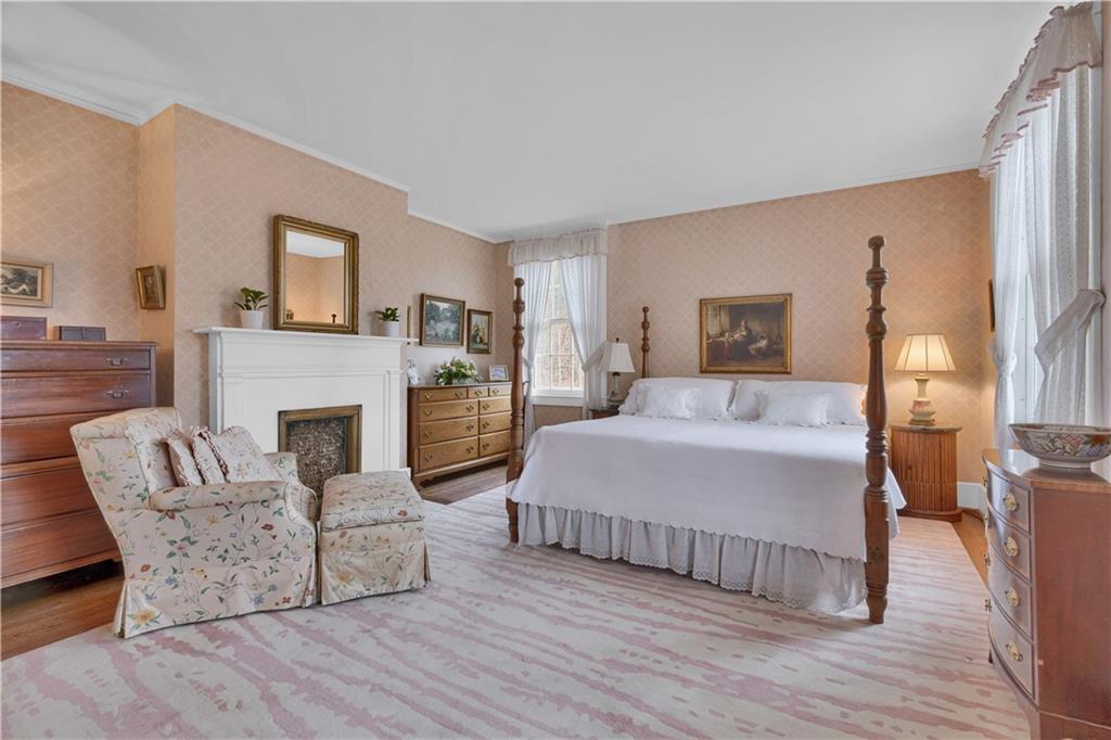 1080 Stanford Road Pittsburgh, PA 15205 - Photo 14 of 24 a bedroom with a bed and a fireplace