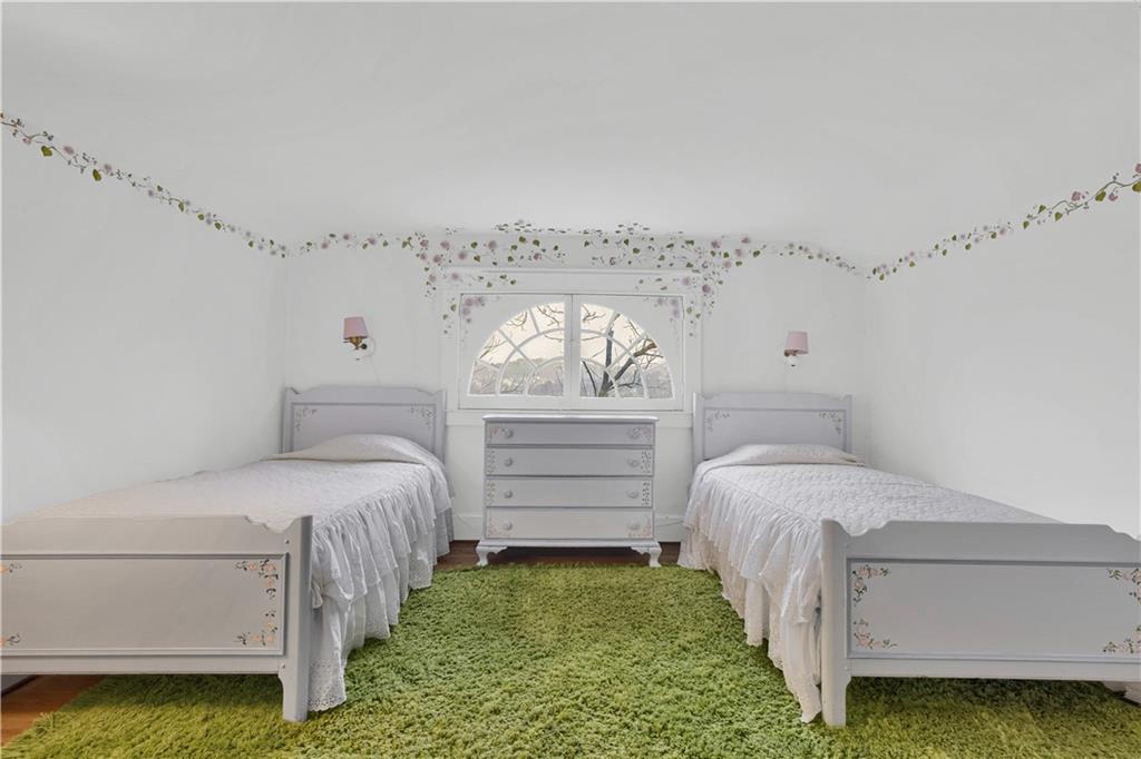 1080 Stanford Road Pittsburgh, PA 15205 - Photo 18 of 24 a bedroom with a bed a chandelier and a window