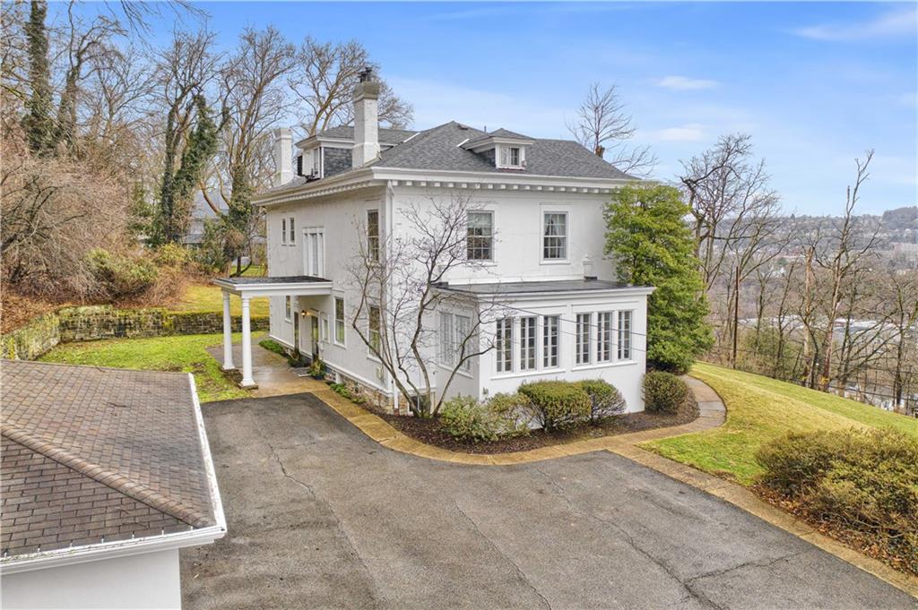 1080 Stanford Road Pittsburgh, PA 15205 - Photo 23 of 24 a view of a white house with a yard and large tree