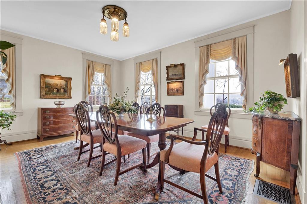 1080 Stanford Road Pittsburgh, PA 15205 - Photo 5 of 24 a dining room with furniture a window and wooden floor