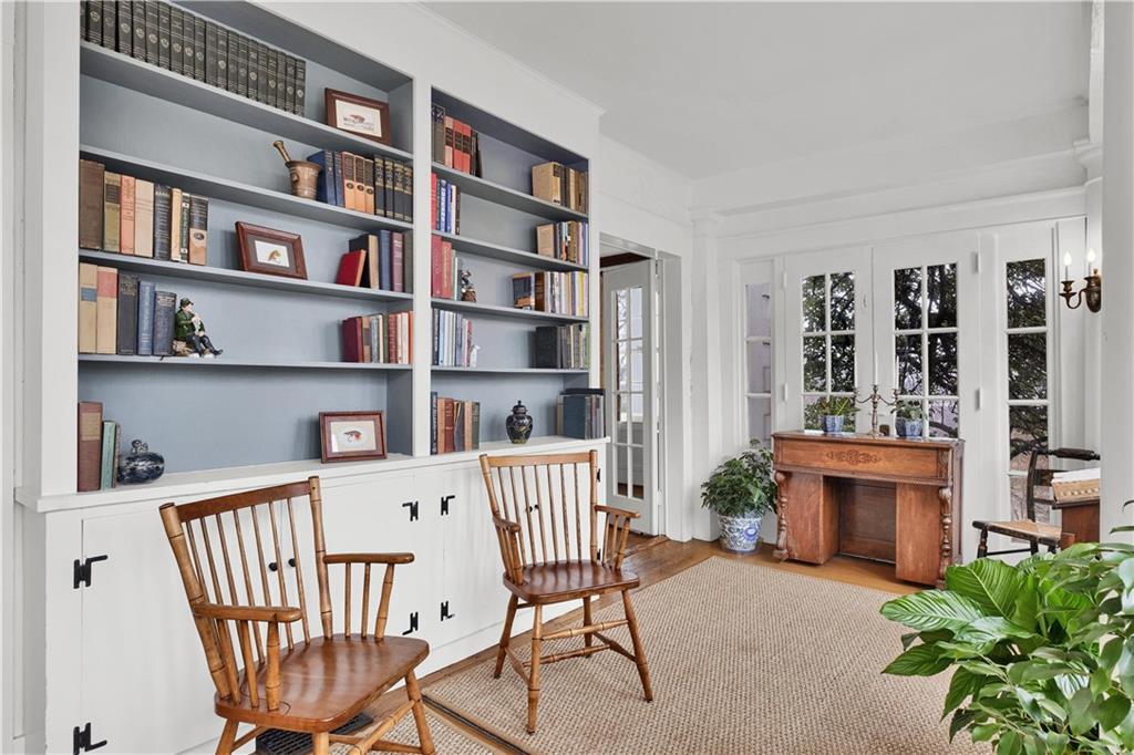 1080 Stanford Road Pittsburgh, PA 15205 - Photo 9 of 24 a view of a workspace with furniture and a book shelf