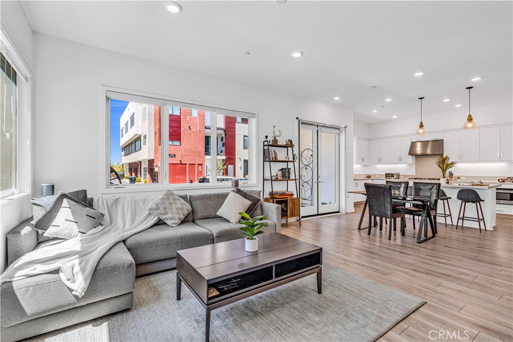 202 Waypoint Tustin, CA 92782 - Photo 11 of 46 a living room with furniture and a large window