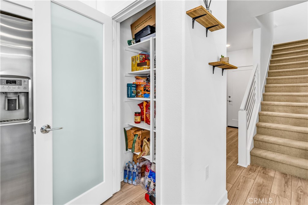 202 Waypoint Tustin, CA 92782 - Photo 16 of 46 a view of walk in closet with clothes and shoes
