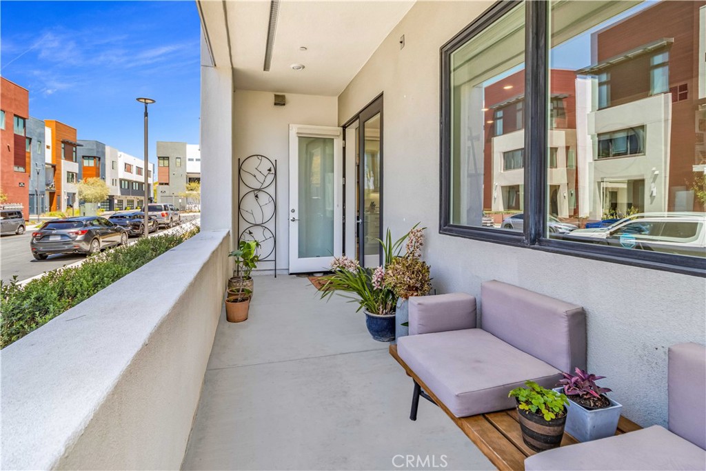 202 Waypoint Tustin, CA 92782 - Photo 18 of 46 a swimming pool with outdoor seating and a potted plant