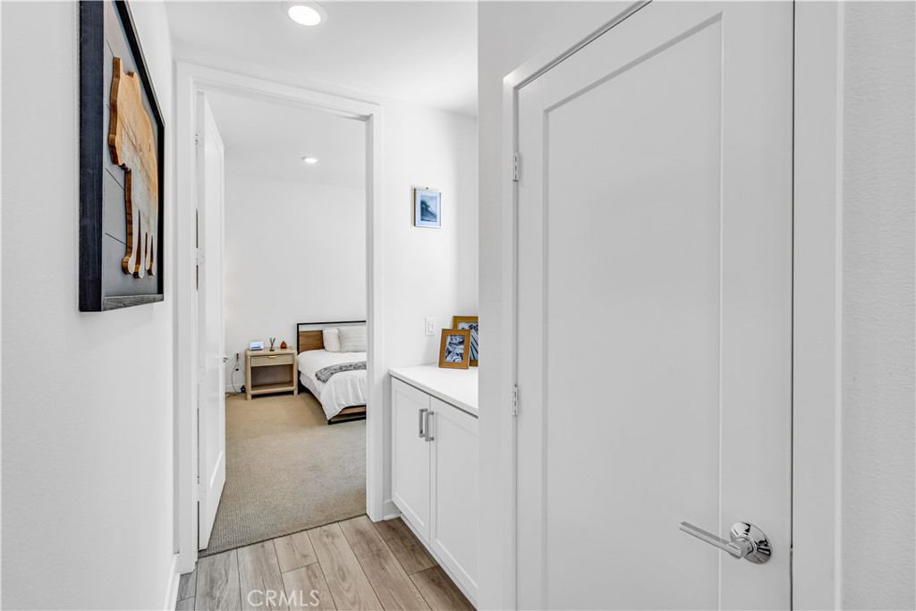 202 Waypoint Tustin, CA 92782 - Photo 19 of 46 a view of a hallway to a livingroom and a dinning room with windows