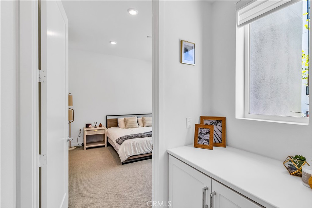 202 Waypoint Tustin, CA 92782 - Photo 20 of 46 a bedroom with a bed and a window