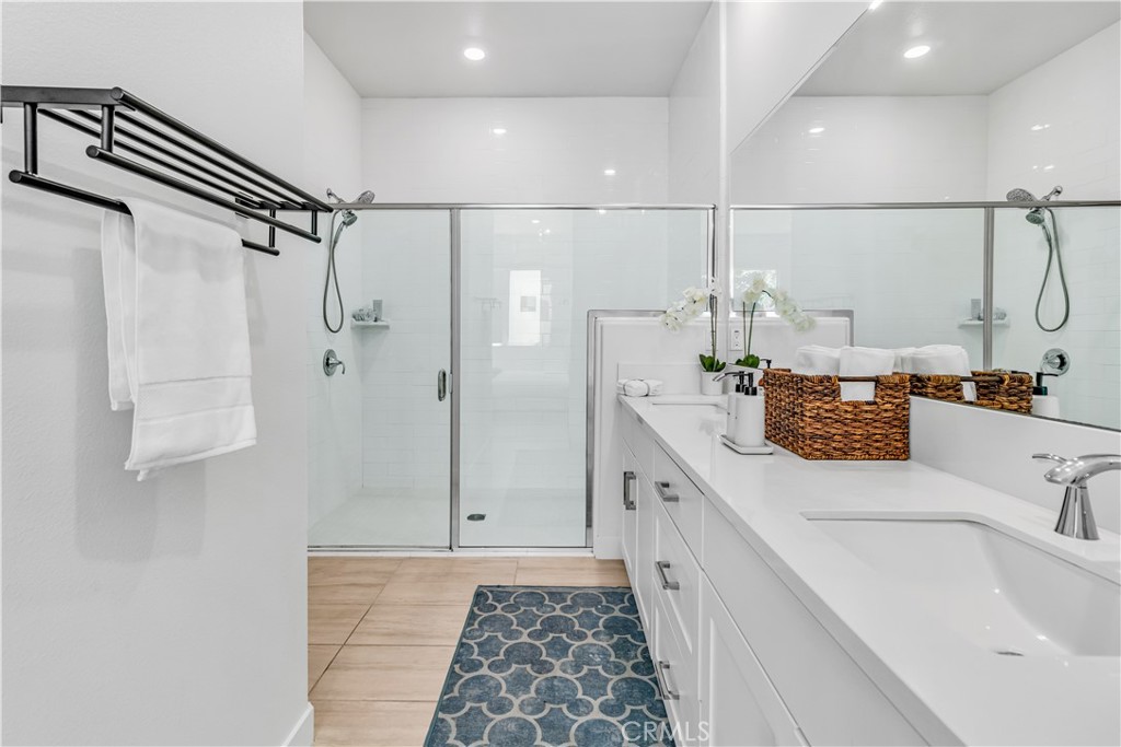 202 Waypoint Tustin, CA 92782 - Photo 23 of 46 a bathroom with a double vanity sink a toilet and shower