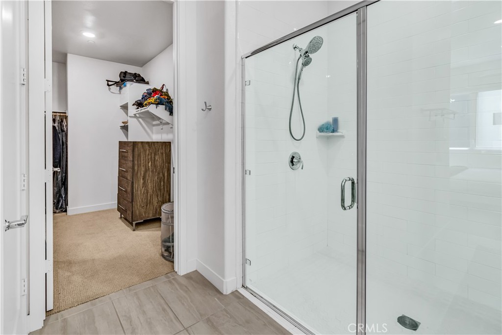 202 Waypoint Tustin, CA 92782 - Photo 25 of 46 a bathroom with a shower and a glass door