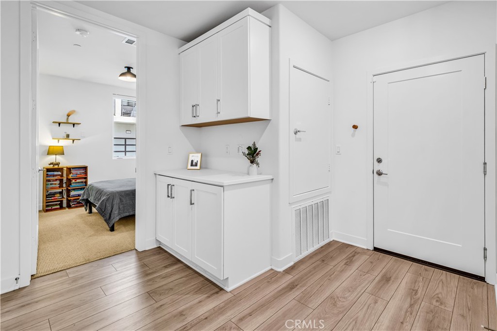 202 Waypoint Tustin, CA 92782 - Photo 27 of 46 a view of kitchen with furniture and wooden floor