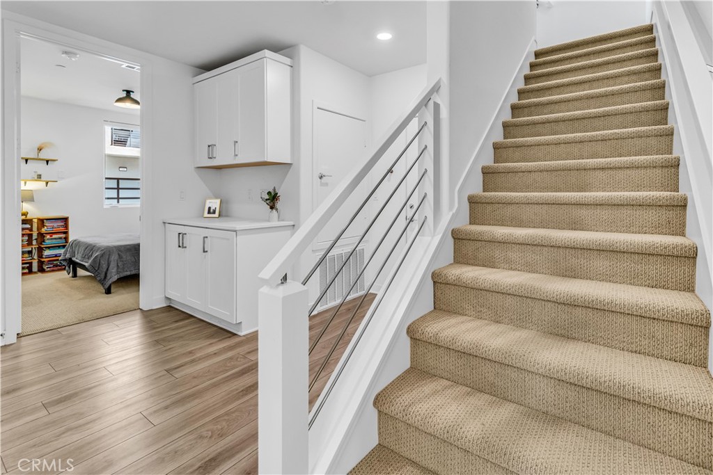 202 Waypoint Tustin, CA 92782 - Photo 30 of 46 a view of entryway and hall with wooden floor