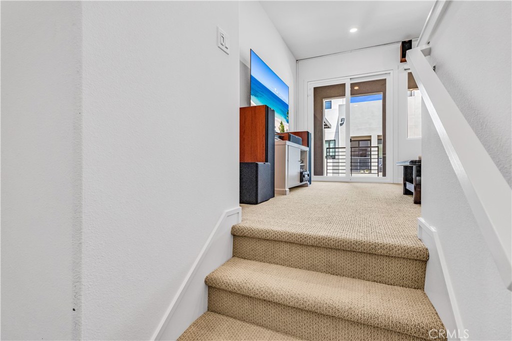 202 Waypoint Tustin, CA 92782 - Photo 31 of 46 a bedroom with a bed and wooden floor