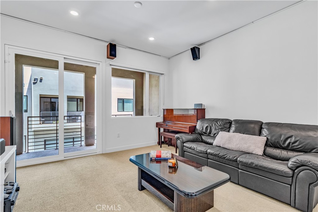 202 Waypoint Tustin, CA 92782 - Photo 32 of 46 a living room with furniture and a window