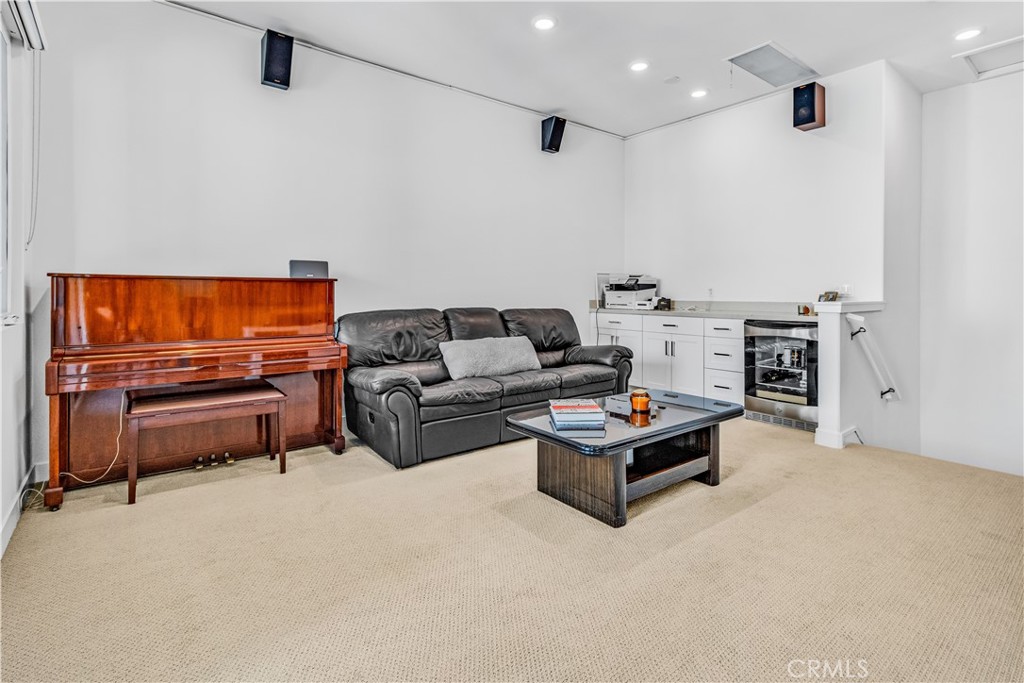 202 Waypoint Tustin, CA 92782 - Photo 33 of 46 a living room with furniture and a flat screen tv