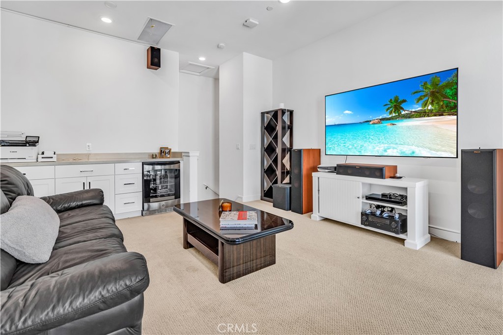 202 Waypoint Tustin, CA 92782 - Photo 35 of 46 a living room with furniture and a flat screen tv
