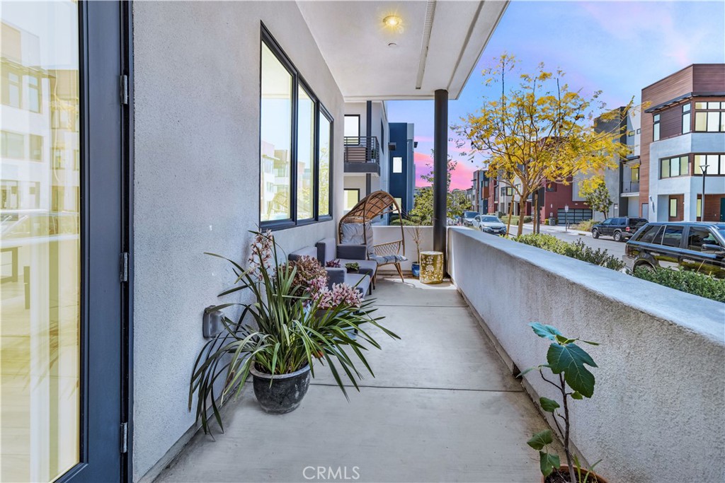 202 Waypoint Tustin, CA 92782 - Photo 6 of 46 a view of a entryway with flower pots