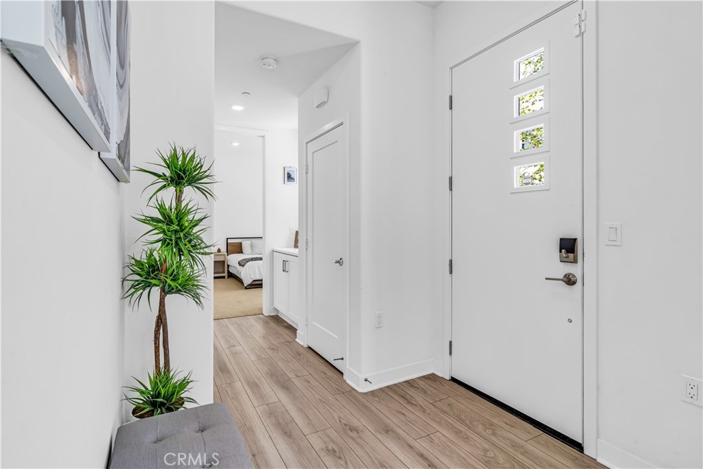 202 Waypoint Tustin, CA 92782 - Photo 7 of 46 a view of entryway with wooden floor