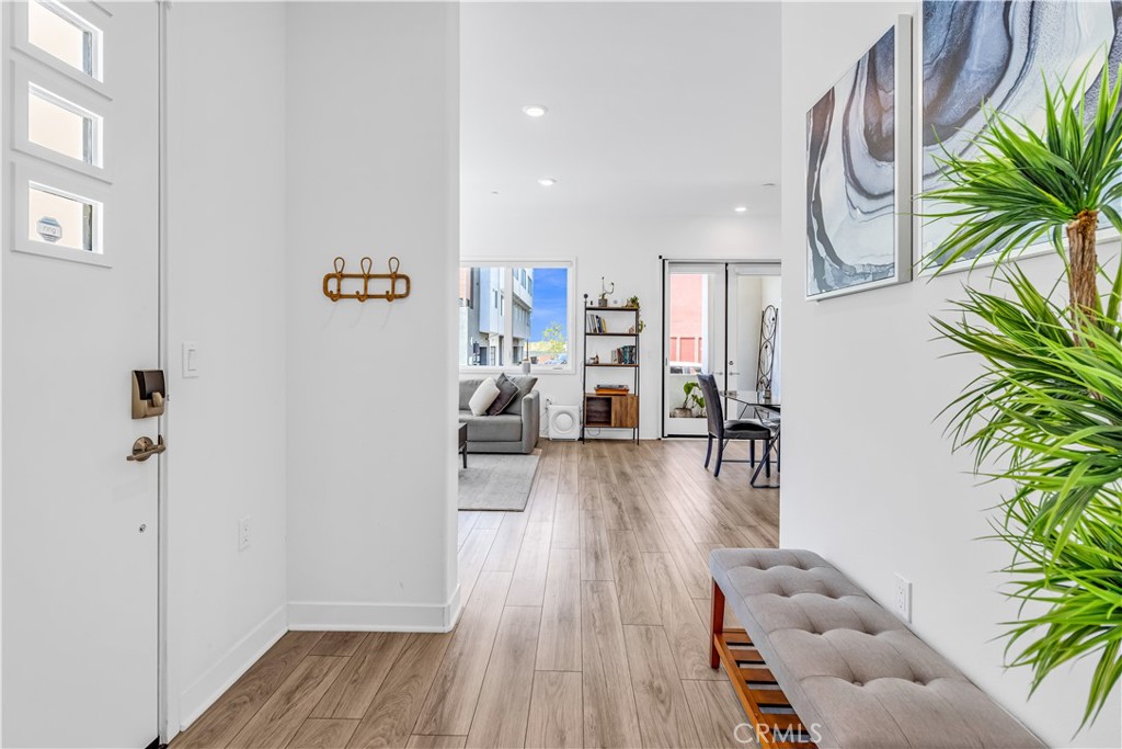 202 Waypoint Tustin, CA 92782 - Photo 8 of 46 a view of livingroom with furniture and wooden floor