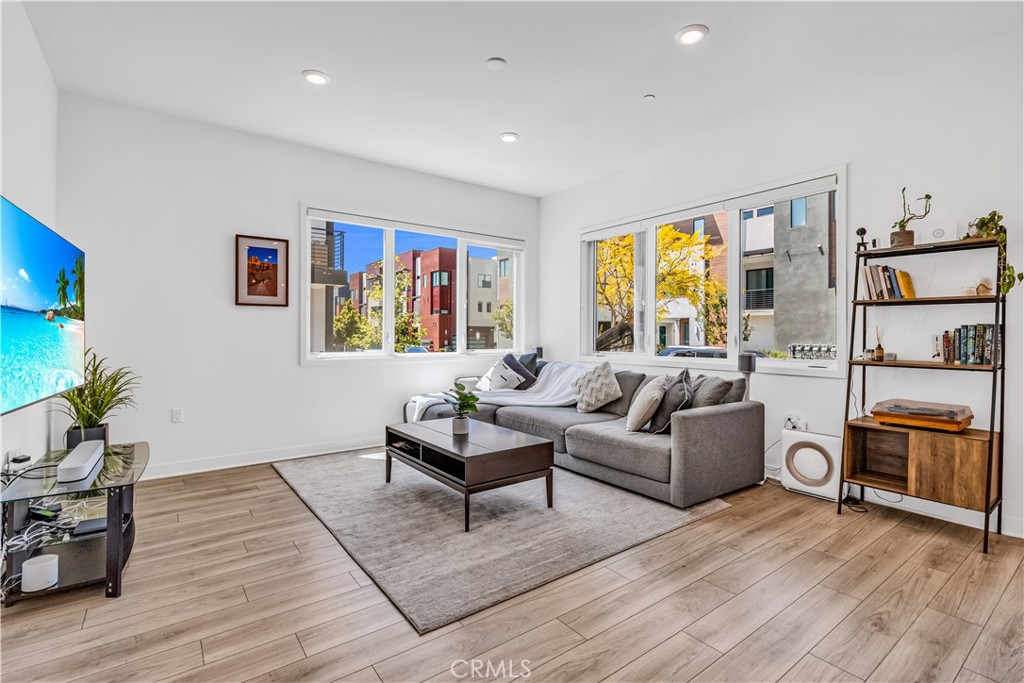 202 Waypoint Tustin, CA 92782 - Photo 9 of 46 a living room with furniture and a flat screen tv