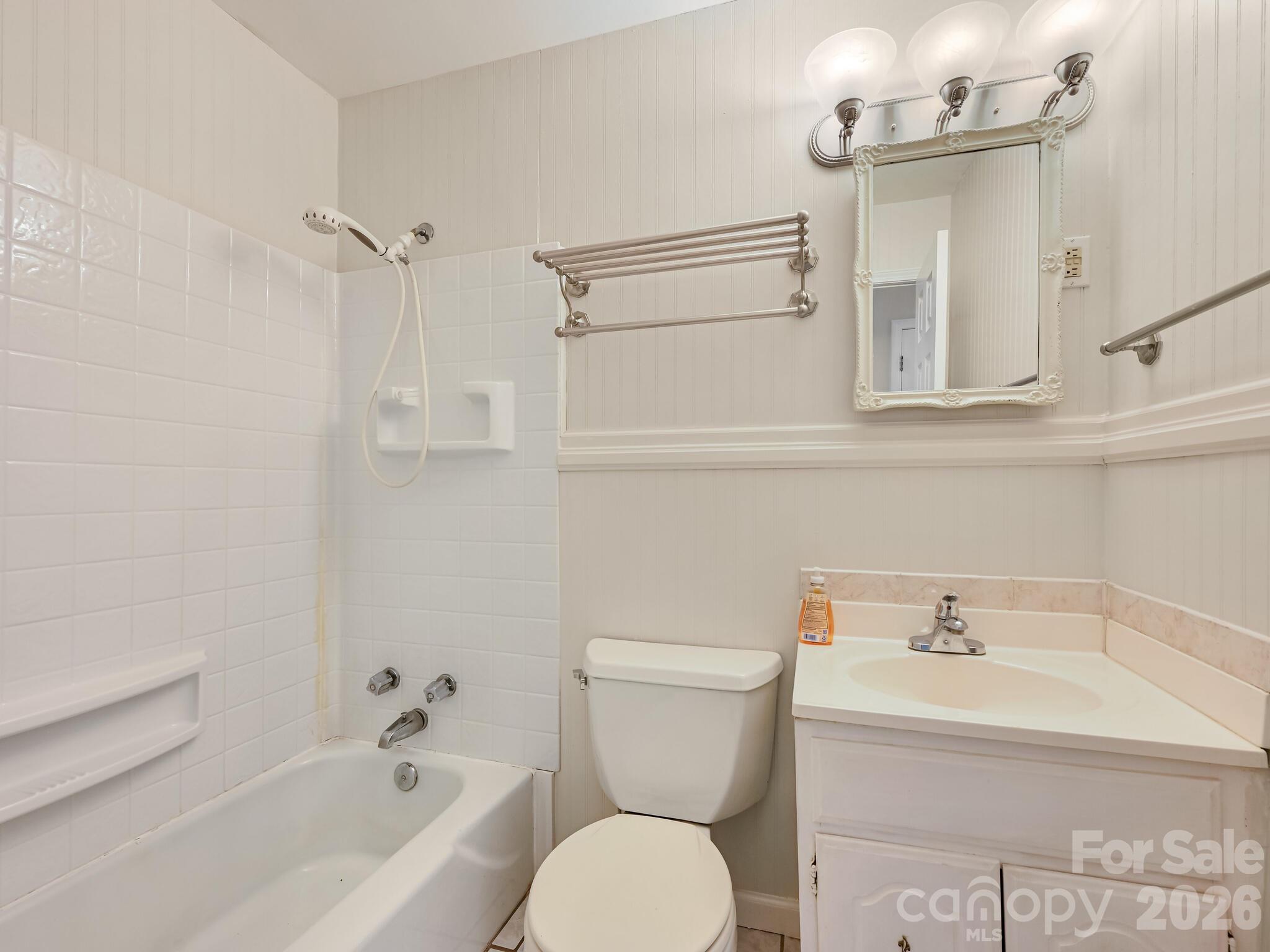 651 Case Cove Road Candler, NC 28715 - Photo 15 of 45 a bathroom with a sink a toilet and a bathtub