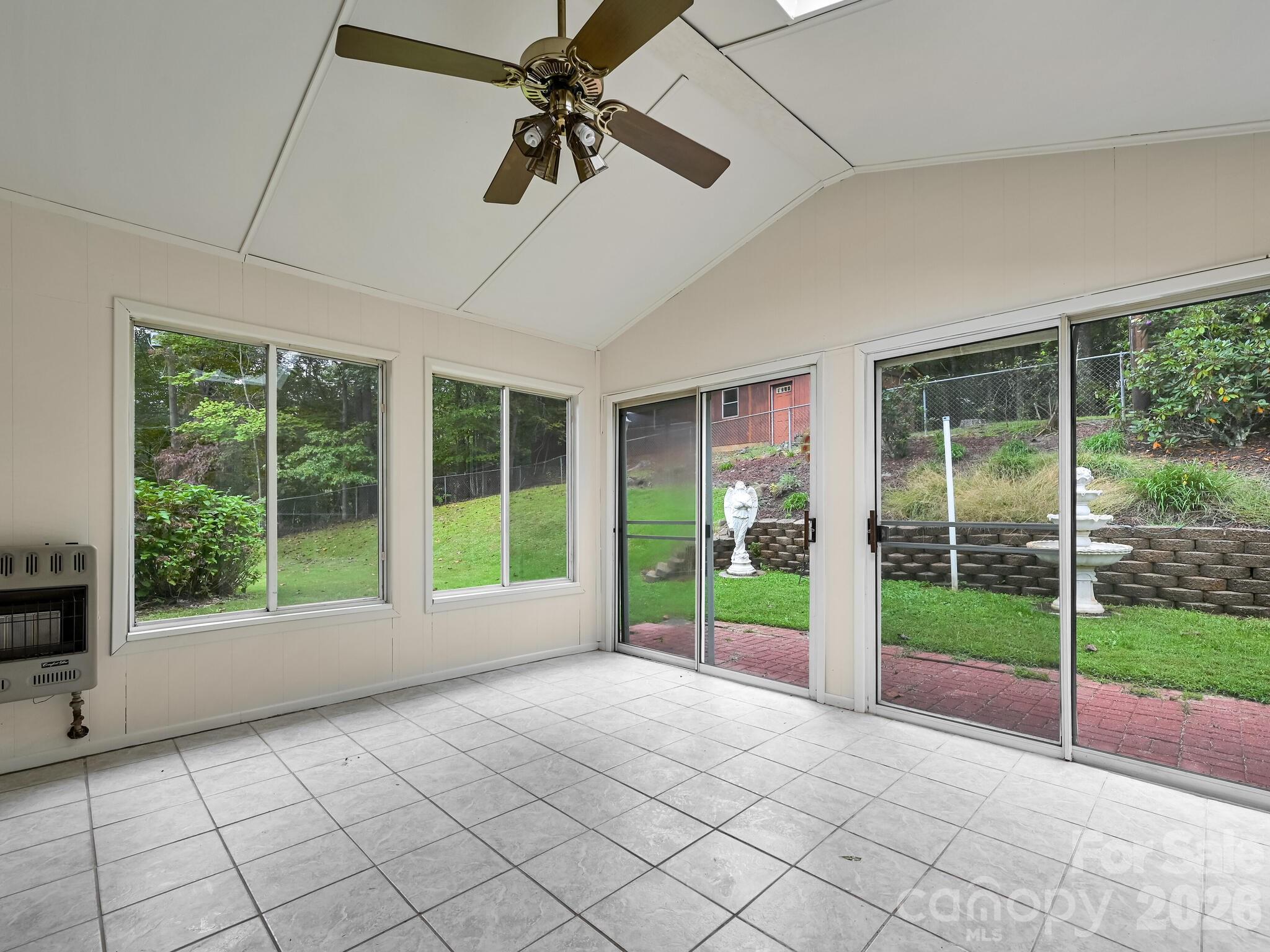 651 Case Cove Road Candler, NC 28715 - Photo 16 of 45 a view of an empty room with windows