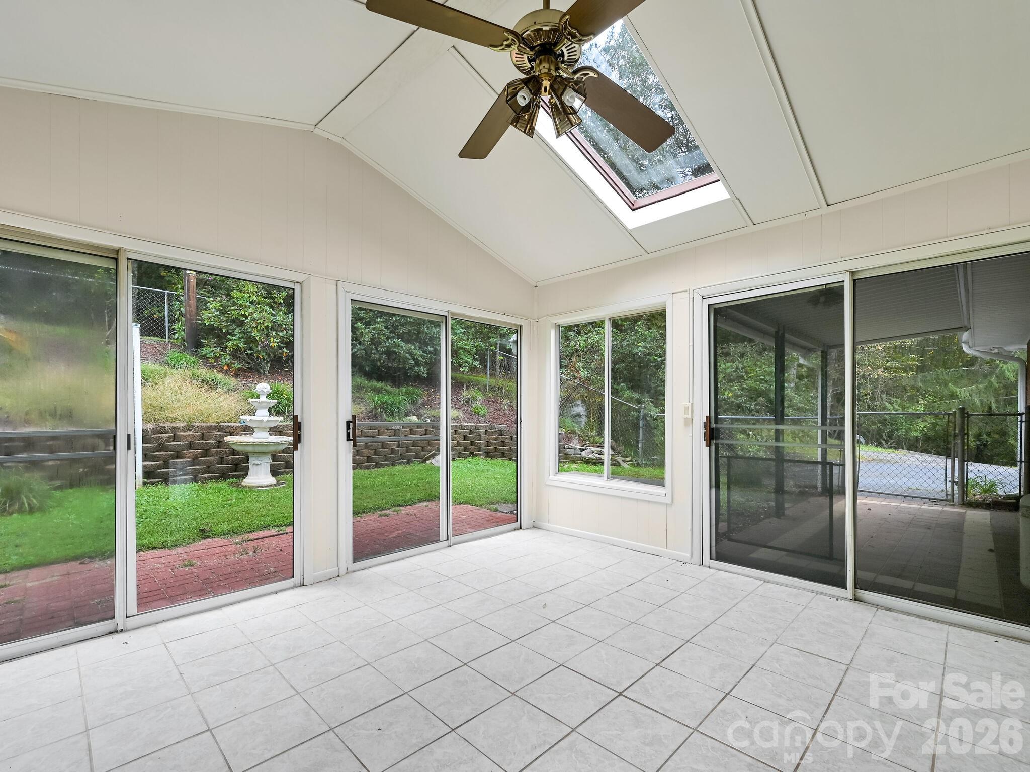 651 Case Cove Road Candler, NC 28715 - Photo 17 of 45 a view of an empty room with windows