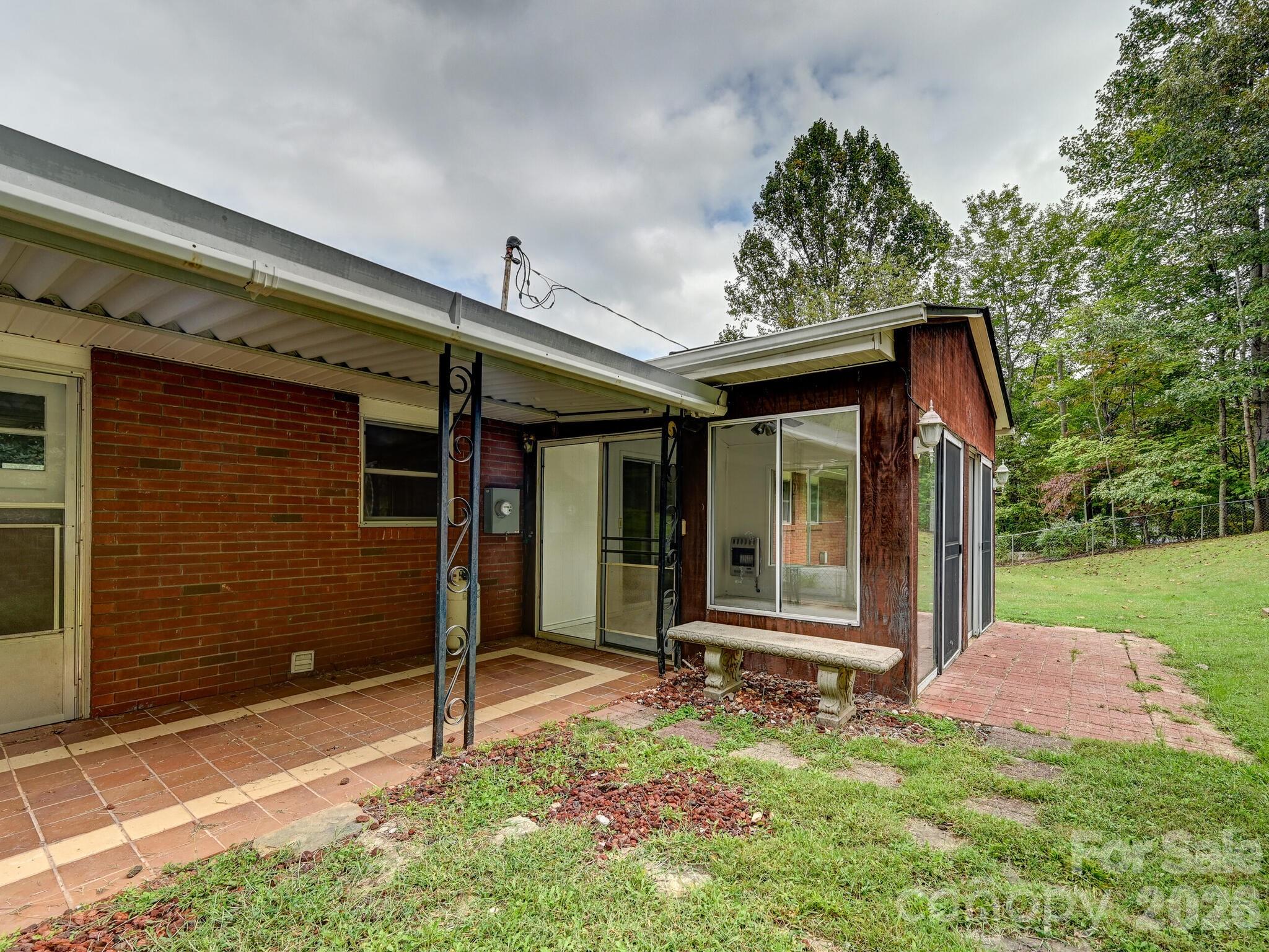 651 Case Cove Road Candler, NC 28715 - Photo 19 of 45 a front view of a house with garden