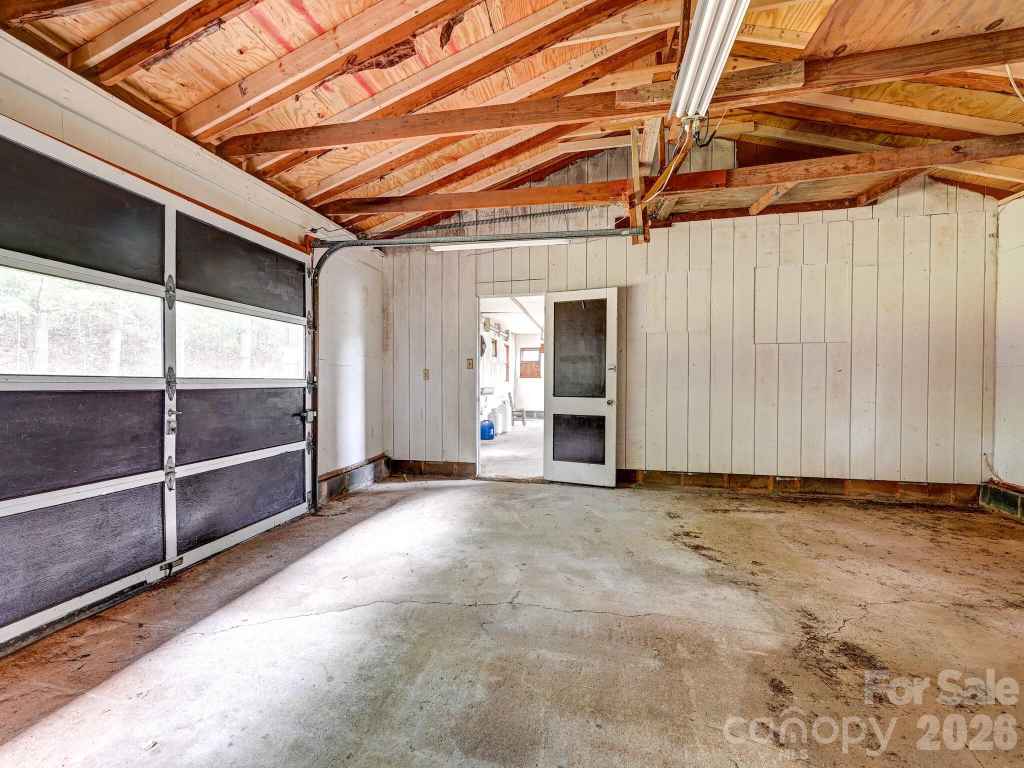 651 Case Cove Road Candler, NC 28715 - Photo 30 of 45 a view of a room with wooden walls