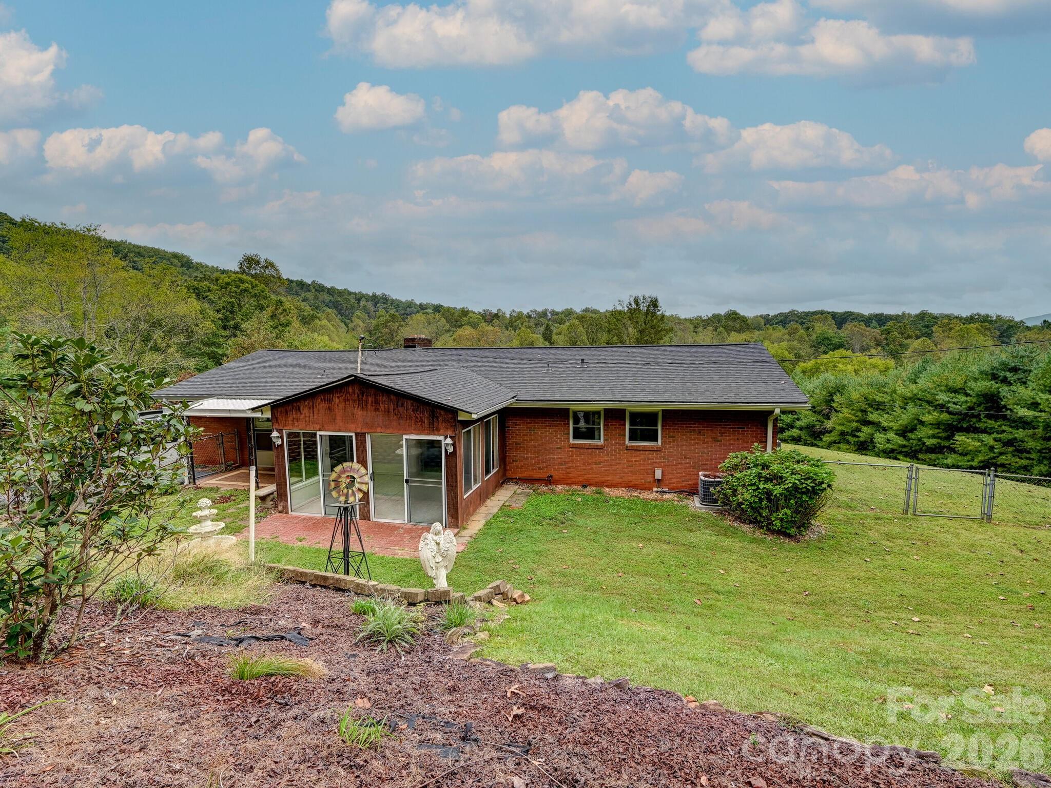 651 Case Cove Road Candler, NC 28715 - Photo 34 of 45 a front view of a house with garden