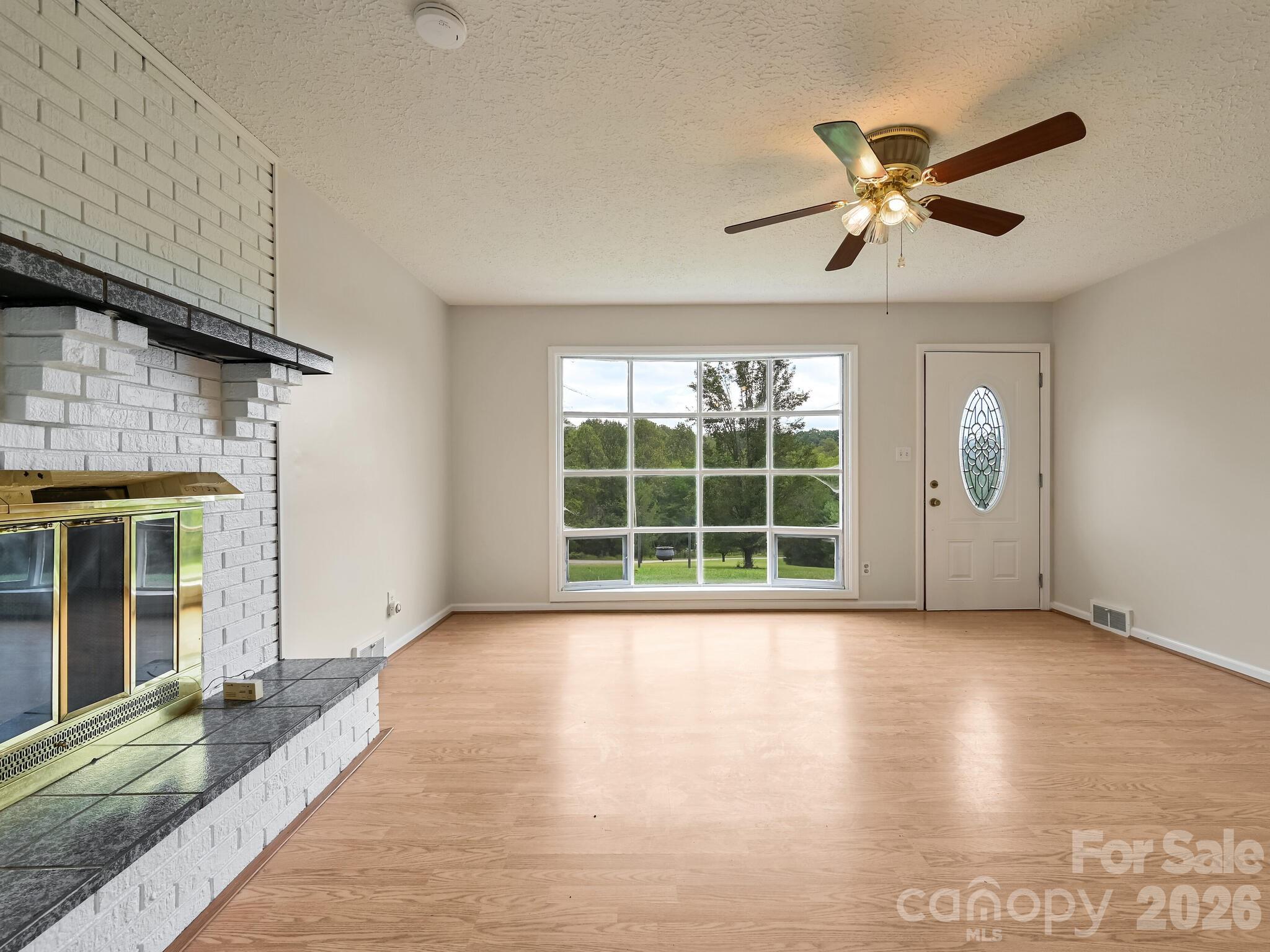 651 Case Cove Road Candler, NC 28715 - Photo 5 of 45 a view of an empty room with a window