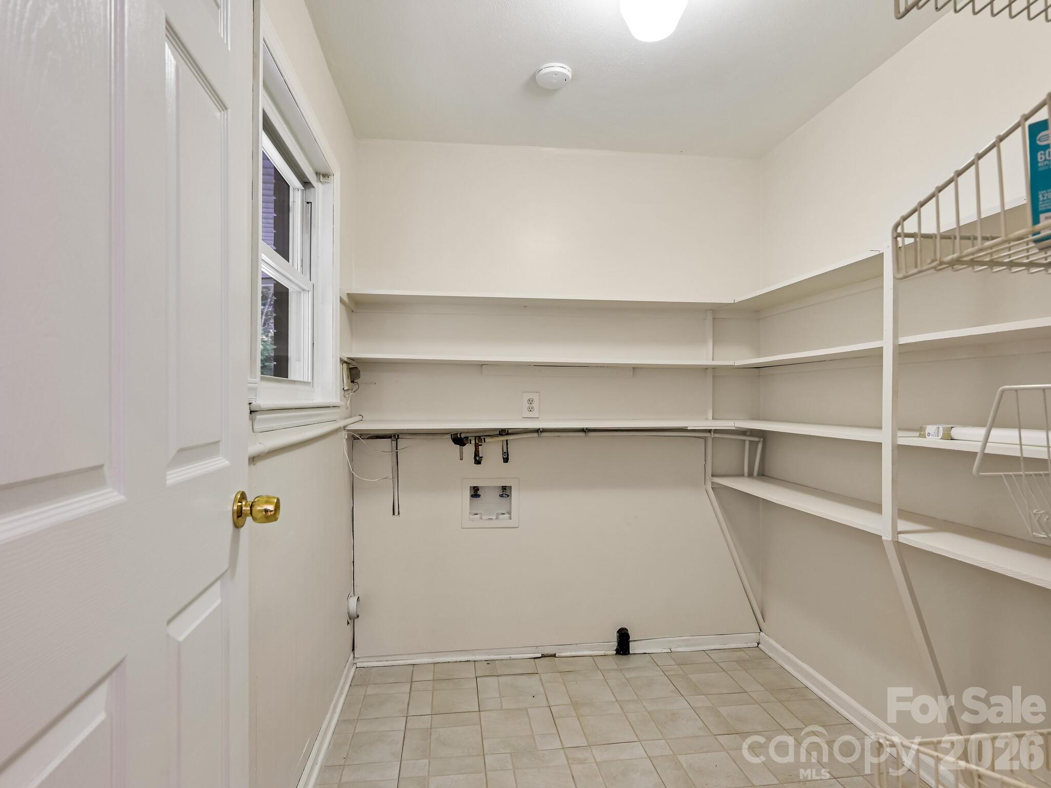 651 Case Cove Road Candler, NC 28715 - Photo 9 of 45 a view of walk in closet with empty racks