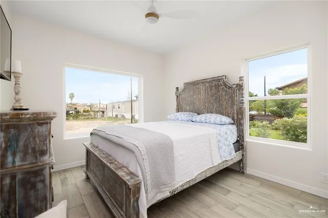 a bedroom with a bed and window