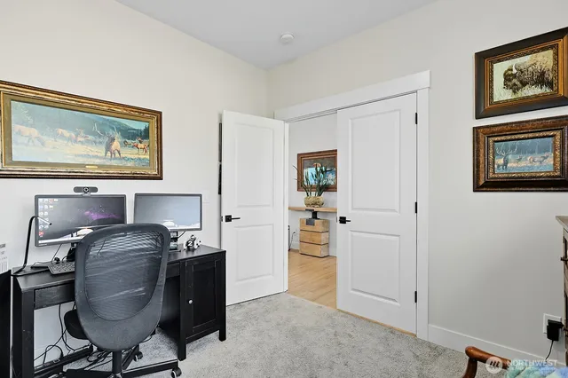 a workspace with furniture and window