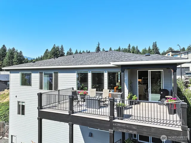 a view of a chair and tables in the balcony