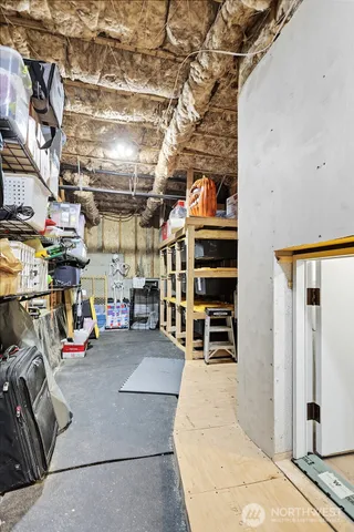 a view of parking garage with cars