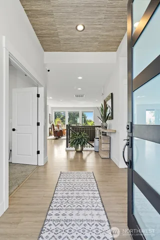 a lobby with furniture and a rug
