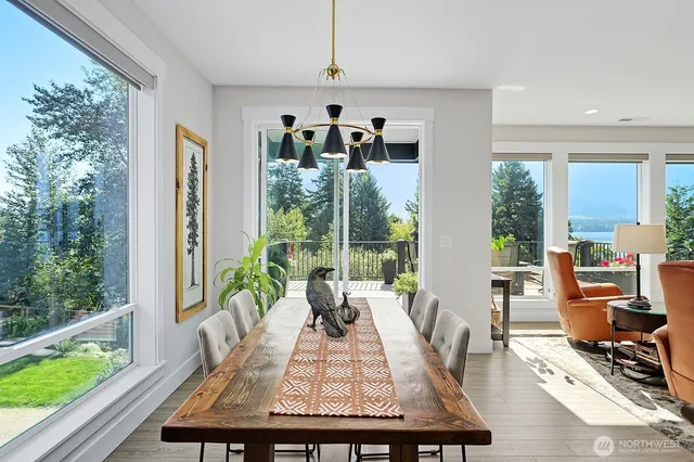 a living room with furniture and large windows