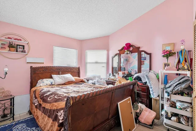 a bedroom with furniture and a bed