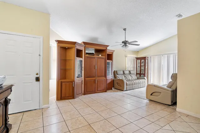 a bedroom with furniture and a chandelier