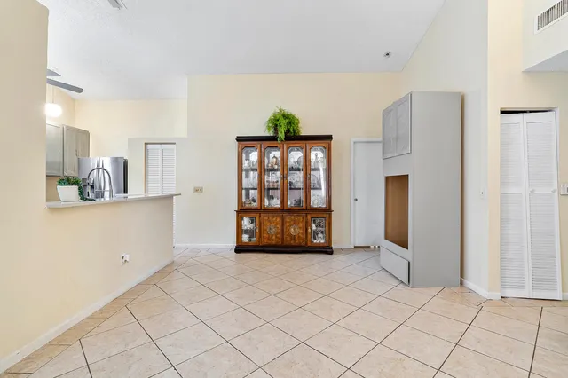 a view of a kitchen with a sink and a window