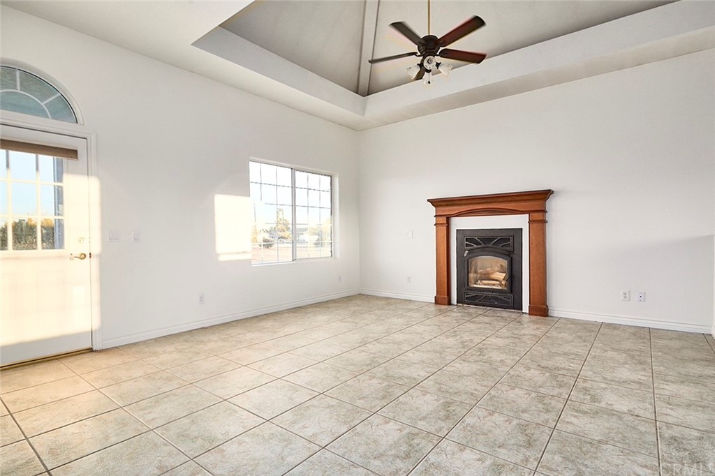 8250 Cataba Road Oak Hills, CA 92344 - Photo 12 of 53 an empty room with windows and fan