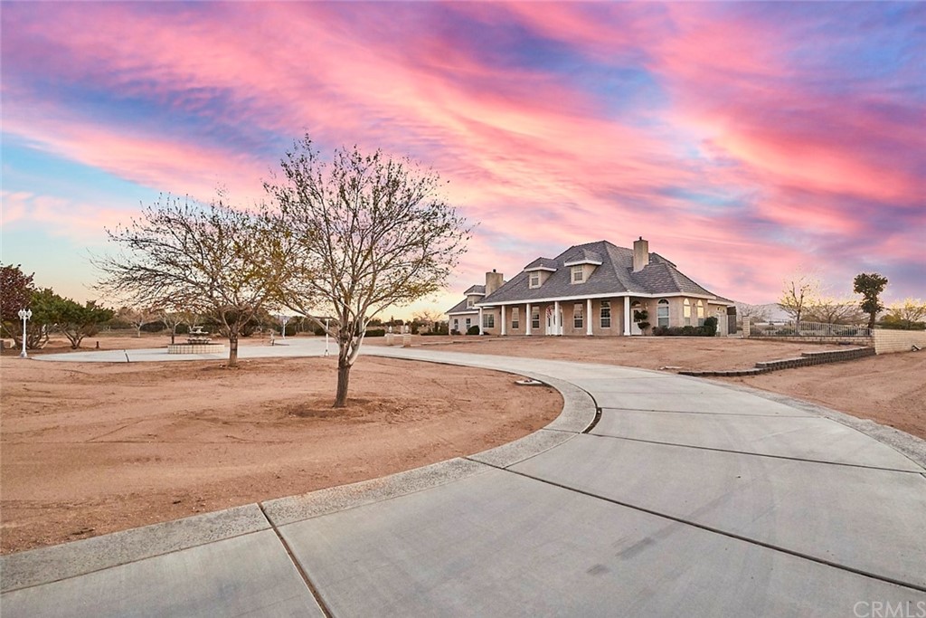 8250 Cataba Road Oak Hills, CA 92344 - Photo 3 of 53 a front view of a house with a yard