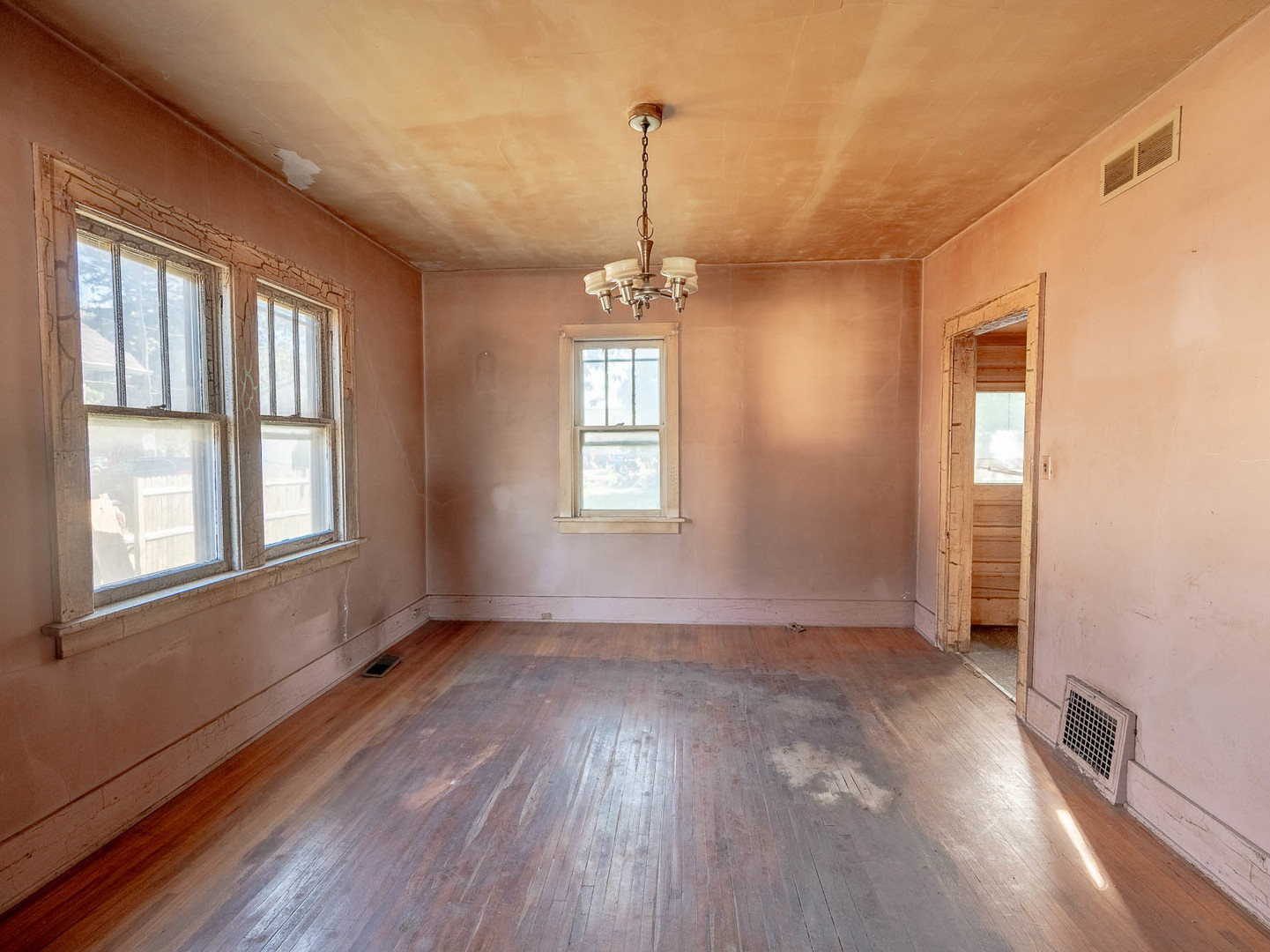 867 Church Road Aurora, IL 60505 - Photo 4 of 12 wooden floor in an empty room with a window