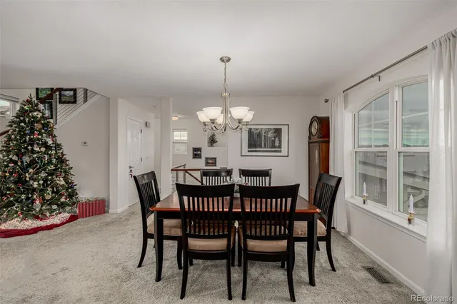 a view of a dining room with furniture and window
