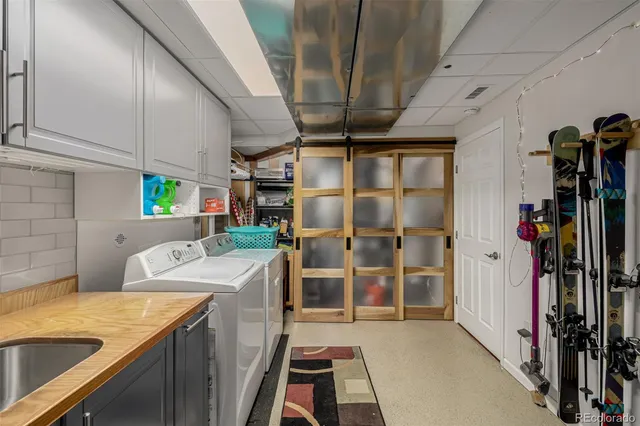 a kitchen with a sink and a stove top oven