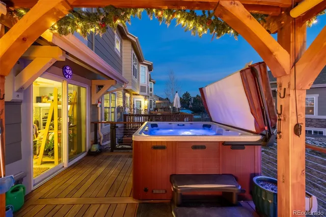 a view of a patio with a table and chairs