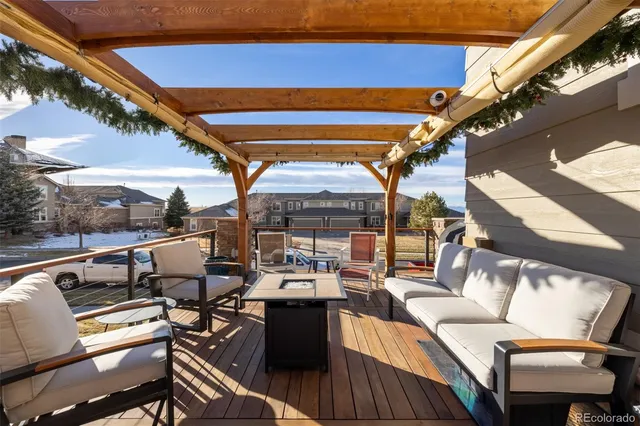 a view of a couches and table in the balcony