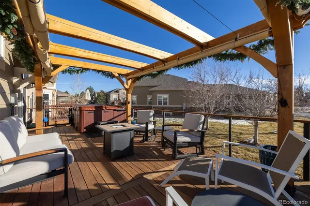 a view of a patio with table and chairs and potted plants